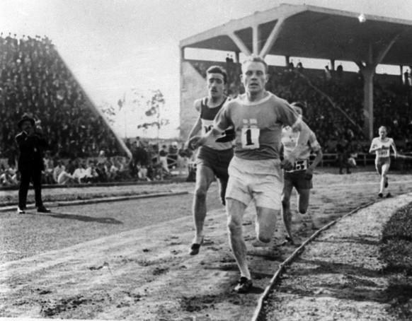 Finnish runner Paavo Nurmi leads the pack in a track event during the 1924 Olympics in Paris, France, July 1924. (KEYSTONE/AP Photo)