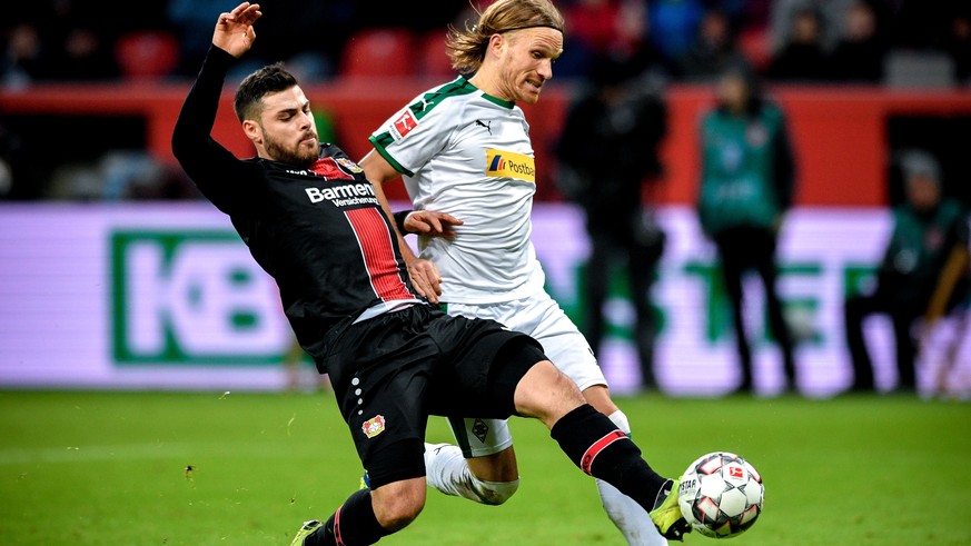 epa07300584 Leverkusen&#039;s Kevin Volland (L) in action against Moenchengladbach&#039;s Michael Lang (R) during the German Bundesliga soccer match between Bayer Leverkusen and Borussia Moenchengladb ...