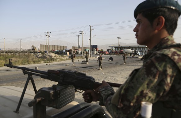 In this Tuesday, Sept. 10, 2019, photo, Afghan National Army soldiers stand guard at a checkpoint in Kabul, Afghanistan. President Donald Trump says U.S.-Taliban talks on ending the war in Afghanistan ...