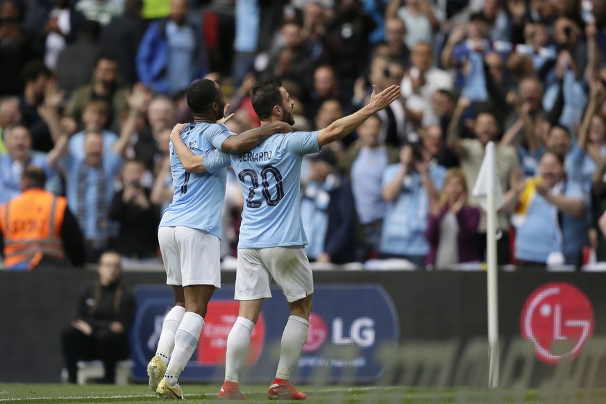 Manchester City&#039;s Raheem Sterling, left, celebrates after scoring his side&#039;s fifth goal with his teammate Manchester City&#039;s Bernardo Silva during the English FA Cup Final soccer match b ...