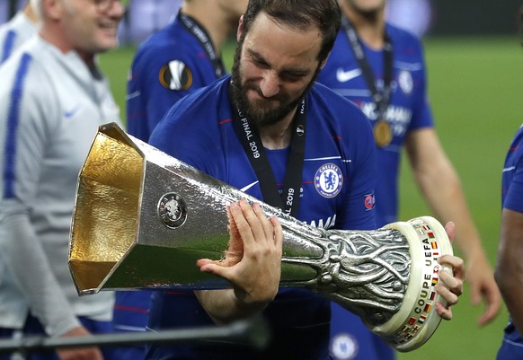 Chelsea&#039;s Gonzalo Higuain holds the trophy after winning the Europa League Final soccer match between Chelsea and Arsenal at the Olympic stadium in Baku, Azerbaijan, Thursday, May 30, 2019. Chels ...
