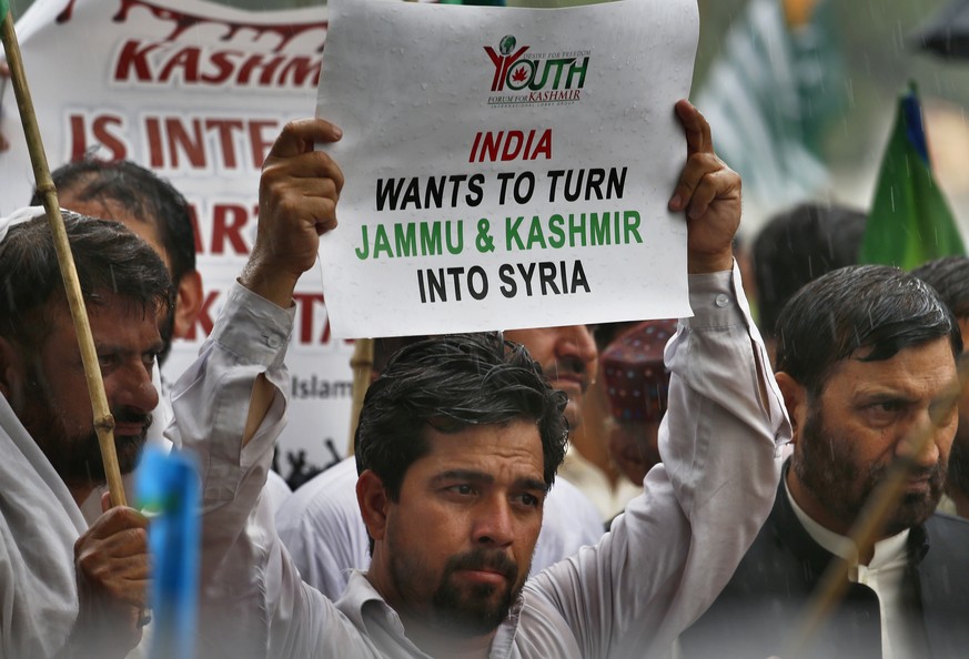 Supporters of the religious group Jamaat-e-Islami attend a rally to protest India&#039;s policy on Kashmir, in Islamabad, Pakistan, Tuesday, Aug. 6, 2019. Pakistan President Arif Alvi convened his cou ...
