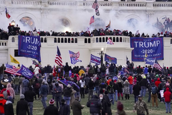 FILE - In this Wednesday, Jan. 6, 2021, file photo, violent rioters supporting President Donald Trump, storm the Capitol in Washington. A faction of local, county and state Republican officials across ...