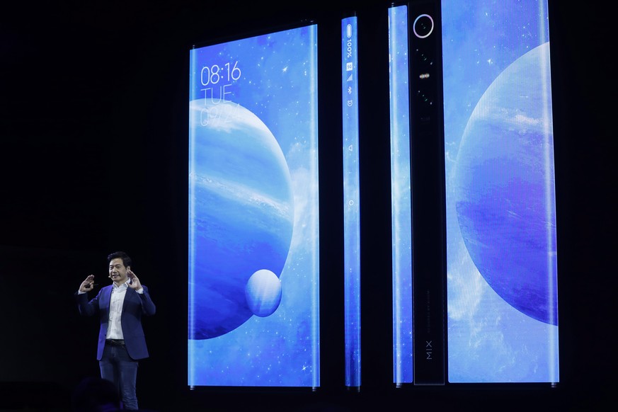 epa07865503 Lei Jun, Founder and CEO of Chinese mobile internet company Xiaomi Technology Co. Ltd., introduces the Xiaomi MIX Alpha smartphone during the Xiaomi new 5G smartphone product launch ceremo ...