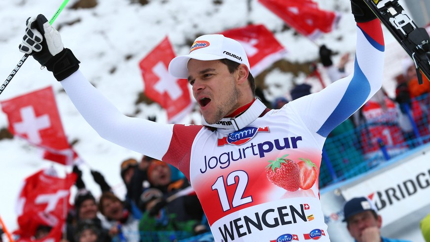 Switzerland&#039;s Patrick Kueng celebrates after winning an alpine ski, men&#039;s World Cup downhill, in Wengen, Switzerland, Saturday, Jan. 18, 2014. Patrick Kueng gave his home Swiss fans a lot to ...
