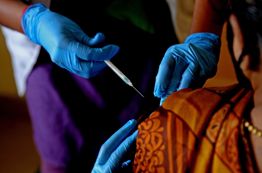 epa09199314 An Indian woman receives a shot of COVID-19 vaccine during the vaccination drive at CV Raman General Hospital in Bangalore, India, 14 May 2021. Bruhat Bengaluru Mahanagara Palike (BBMP) Ch ...