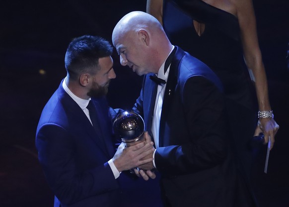 Argentinian Barcelona player Lionel Messi receives the Best FIFA mens player award from FIFA president Gianni Infantino during the ceremony of the Best FIFA Football Awards, in Milan&#039;s La Scala t ...