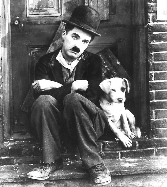 A MAN`S BEST FRIEND: Charlie Chaplin and unnamed friend are shown in a scene from &quot;Dog`s Life&quot;. (AP-Photo/md/HO/)