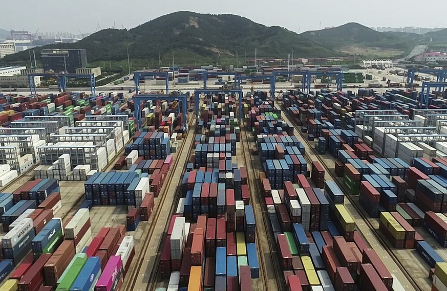 Containers are placed at a port in Qingdao in eastern China&#039;s Shandong province on Tuesday, Sept. 1, 2020. China&#039;s export growth accelerated in August while imports edged lower as the world& ...