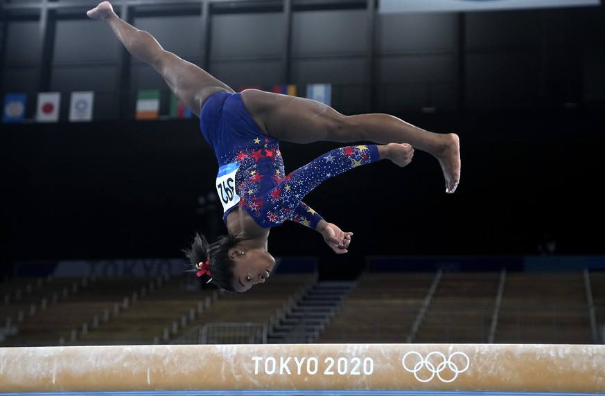 Simone Biles, of the United States, performs on the balance beam during the women&#039;s artistic gymnastic qualifications at the 2020 Summer Olympics, Sunday, July 25, 2021, in Tokyo. (AP Photo/Natac ...