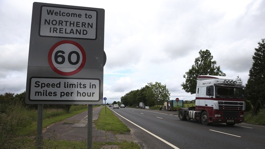 FILE - This is a June 15, 2016 file photo of of traffic crossing the border between the Republic of Ireland and Northern Ireland in the village of Bridgend, Co Donegal Ireland. Britain said Wednesday  ...