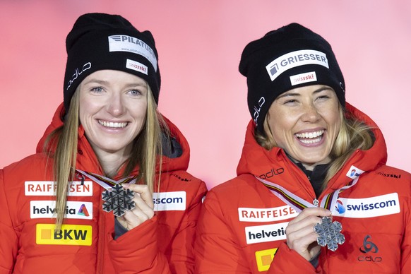 Nadine Faehndrich, left, and Laurien van der Graaff of Switzerland react with their silver medals after the team sprint finals at the 2021 Nordic Skiing World Championships, in Oberstdorf, Germany, on ...