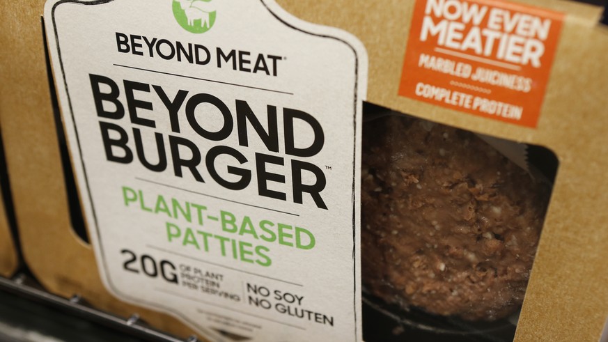 FILE - In this June 27, 2019, file photo a meatless burger patty called Beyond Burger made by Beyond Meat is displayed at a grocery store in Richmond, Va. Shares of Beyond Meat are tumbling in Thursda ...