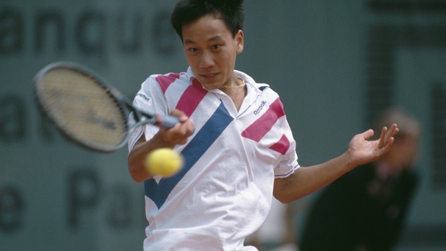 American tennis player Michael Chang at the French Open in Paris, 1989. He won the tournament, becoming the youngest male winner of a Grand Slam singles event at the age of 17. (Photo by Simon Bruty/G ...