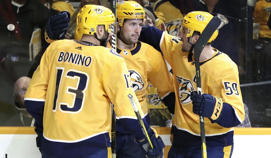 Nashville Predators&#039; Filip Forsberg, center, of Sweden, is congratulated by Nick Bonino (13) and Roman Josi (59), of Switzerland, after Forsberg scored against the Arizona Coyotes during the seco ...