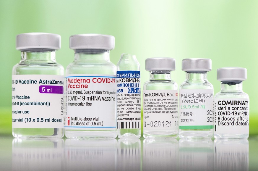 epaselect epa09110434 Empty vials that contained the COVID-19 vaccines available in Hungary, such as from AstraZeneca, Moderna, A and B of Sputnik V, Sinopharm, Pfizer-BioNTech, left to right, are see ...