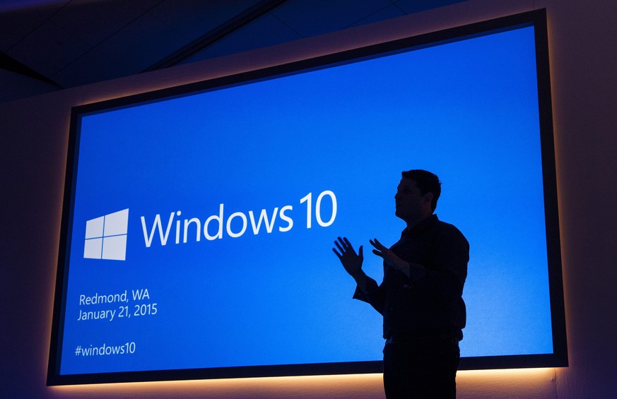 epa04575678 Handout image released by Microsoft showing Microsoft Executive Vice President of Operating Systems Terry Myerson speaking during a Windows 10 press conference in Redmond, Washington, USA, ...