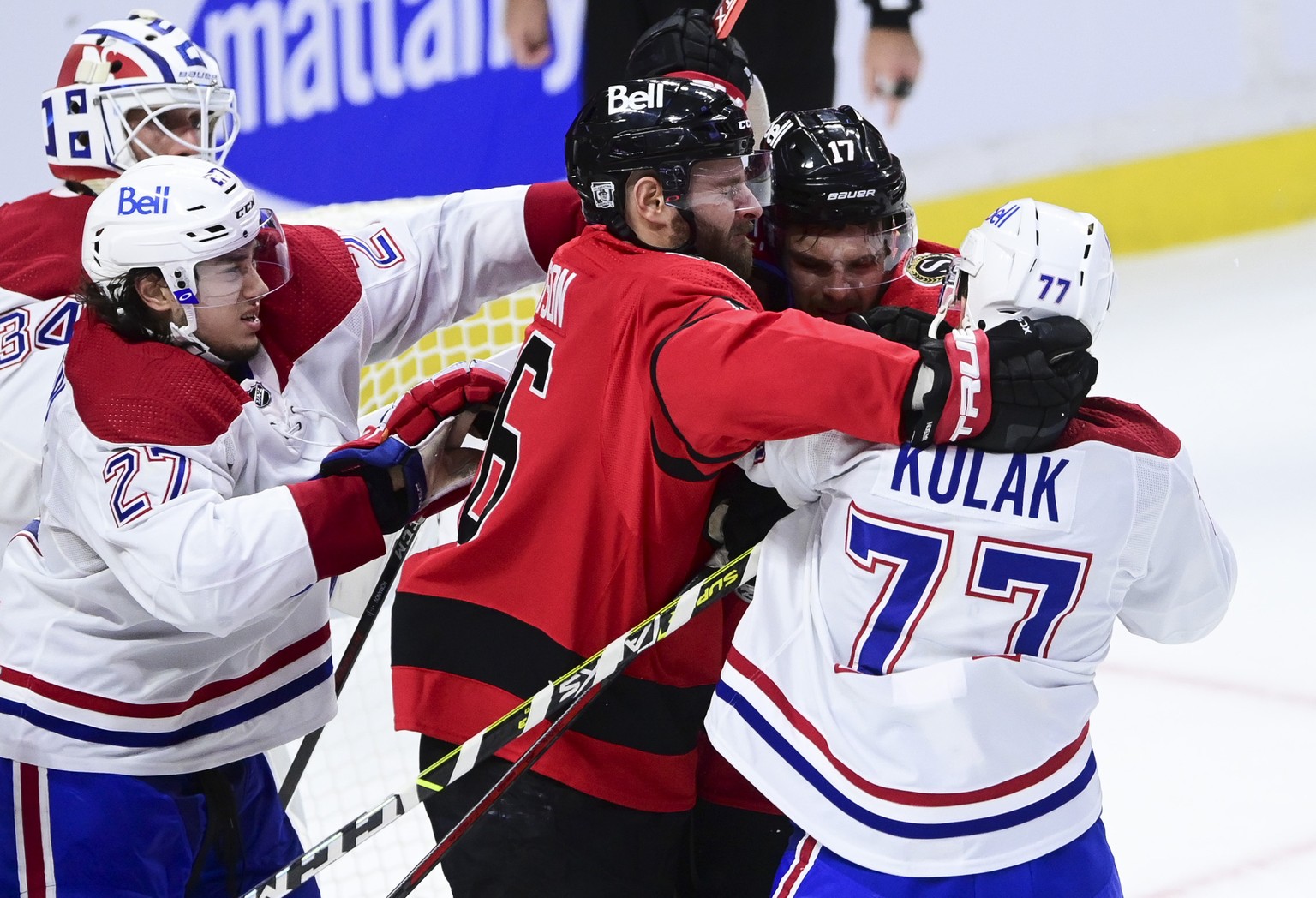 Tempers flare between Ottawa Senators&#039; left wing Austin Watson (16) and Alex Galchenyuk (17) and Montreal Canadiens defenseman Brett Kulak (77) during the second period of an NHL hockey game in O ...