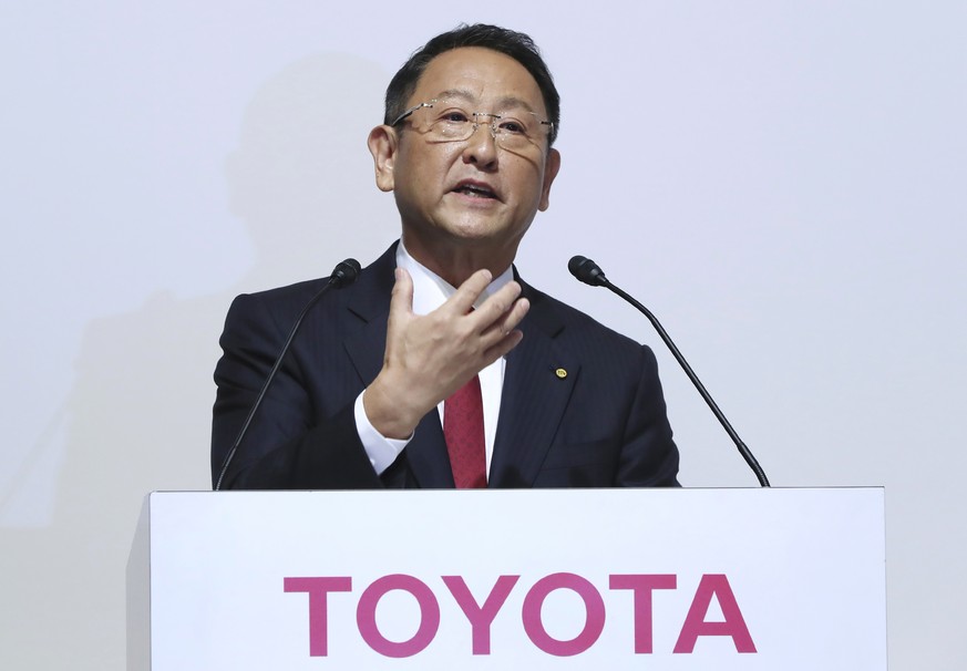 FILE - In this Aug. 4, 2017, file photo, Toyota Motor Corp. President Akio Toyoda answers a question during a joint press conference with Mazda Motor Corp. President Masamichi Kogai in Tokyo. A suicid ...