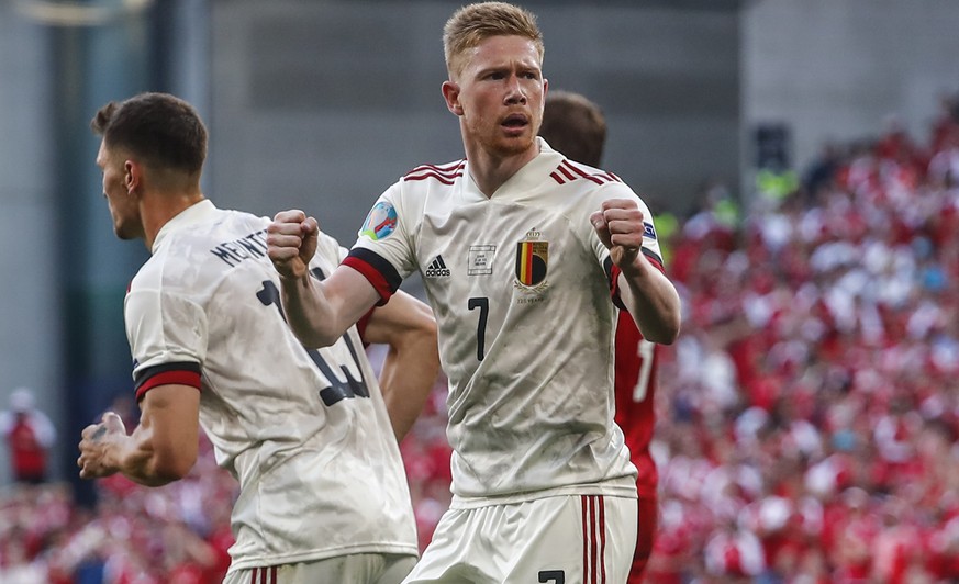 Belgium&#039;s Kevin De Bruyne reacts after Thorgan Hazard scored during the Euro 2020 soccer championship group B match between Denmark and Belgium, at the Parken stadium in Copenhagen, Thursday, Jun ...