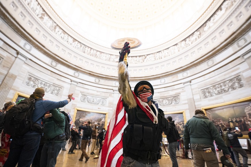 epa08923421 Supporters of US President Donald J. Trump in the Capitol Rotunda after breaching Capitol security in Washington, DC, USA, 06 January 2021. Protesters entered the US Capitol where the Elec ...