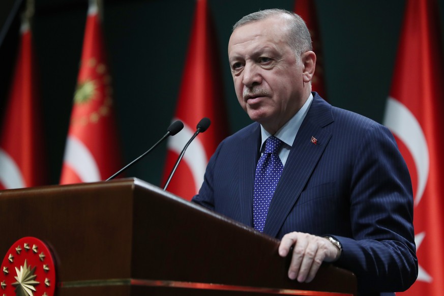 epa09117564 A handout picture provided by the Turkish President Press office shows, Turkish President Recep Tayyip Erdogan speaks to the media after an evaluation meeting at the Presidential Palace in ...