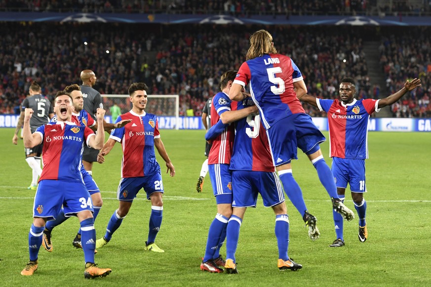 Basel&#039;s players celebrate their 3rd goal with Dimitri Oberlin, right, and Taulant Xhaka left, during an UEFA Champions League Group stage Group A matchday 2 soccer match between Switzerland&#039; ...