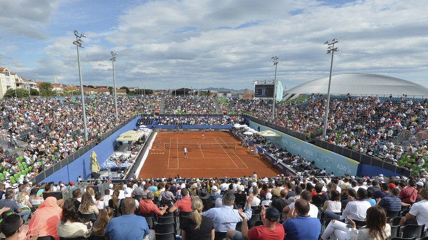 Spectators watch a tennis match during an exhibition tournament in Zadar, Croatia, Sunday, June 21, 2020. Tennis player Grigor Dimitrov says he has tested positive for COVID-19 and his announcement le ...