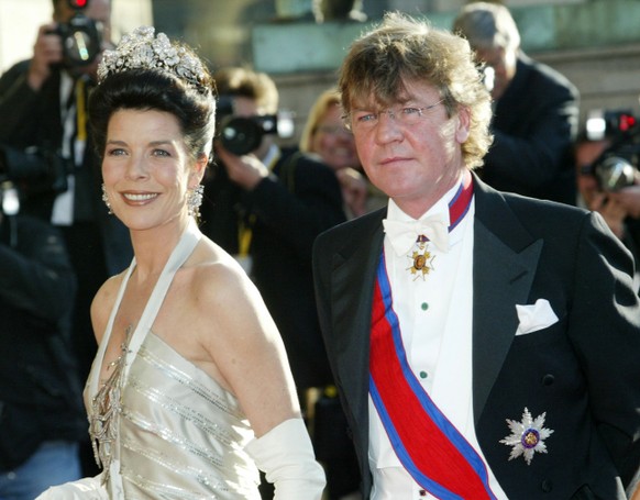 Monaco&#039;s Princess Caroline and Prince Ernst August of Hannover pass press photographers on their way to the Royal Theater in Copenhagen on Thursday, May 13, 2004. On the eve of the marriage of De ...