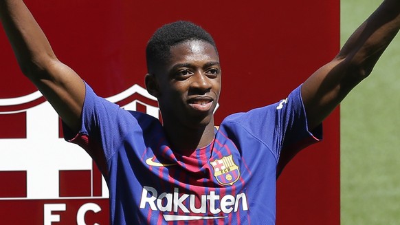 FC Barcelona&#039;s new signing Ousmane Dembele gestures during his official presentation at the Camp Nou stadium in Barcelona, Spain, Monday, Aug. 28, 2017. Barcelona is shoring up its attack followi ...