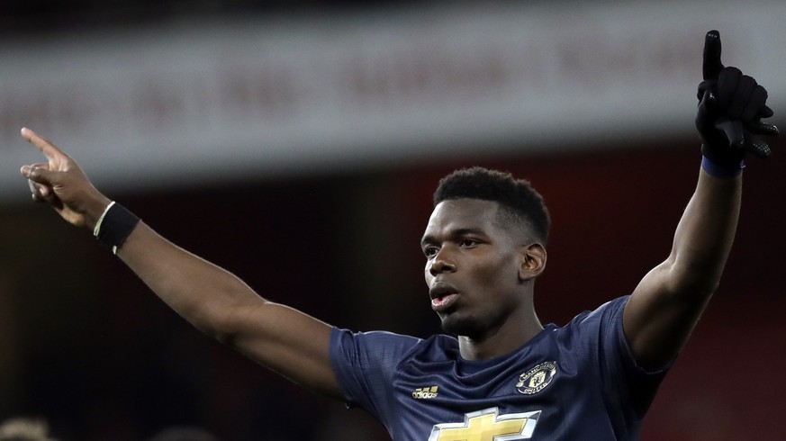 Manchester United&#039;s Paul Pogba celebrates at the end of the English FA Cup fourth round soccer match between Arsenal and Manchester United at the Emirates stadium in London, Friday, Jan. 25, 2019 ...