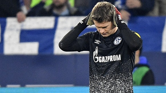 Schalke&#039;s goalkeeper Alexander Nuebel reacts after receiving another goal during the German Bundesliga soccer match between FC Schalke 04 and RB Leipzig at the arena in Gelsenkirchen, Germany, Sa ...