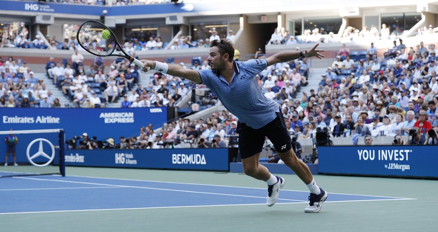epa07815573 Stan Wawrinka of Switzerland hits a return to Daniil Medvedev of Russia during their quarter-finals round match on the ninth day of the US Open Tennis Championships the USTA National Tenni ...