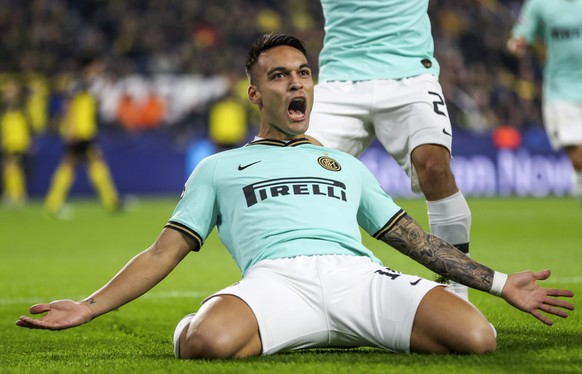 epa07974997 Inter&#039;s Lautaro Martinez celebrates after scoring the opening goal during the UEFA Champions League group F soccer match between Borussia Dortmund and Inter Milan in Dortmund, Germany ...