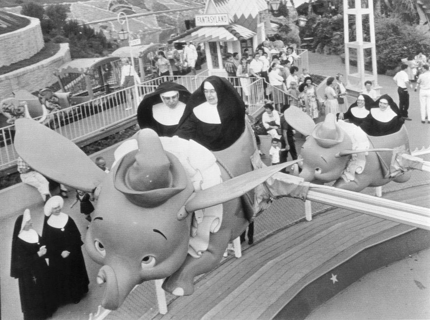 Catholic School Day at Disneyland and Sisters Mary William and Mary Alfred take the first elephant as Sisters Mary Yvonne and Mary Joachin follow close behind as they join the children in a ride on &q ...