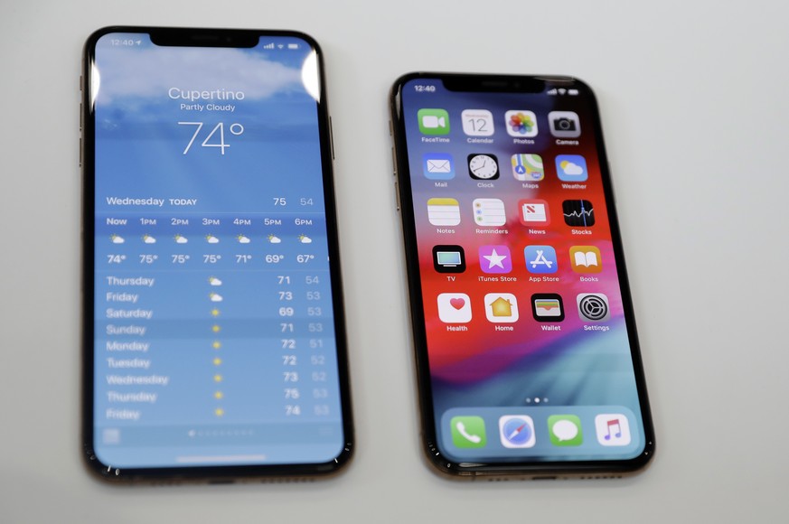 The iPhone XS, right, and XS Max are displayed side to side during an event to announce new products at Apple headquarters Wednesday, Sept. 12, 2018, in Cupertino, Calif. (AP Photo/Marcio Jose Sanchez ...