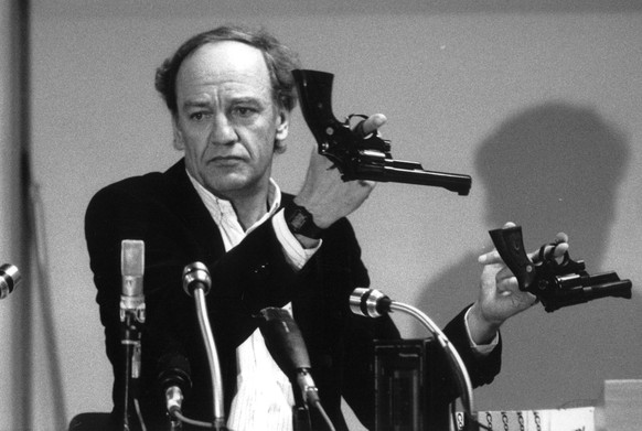 FILE - In this March 31, 1986 file photo Hans Holmer, former head of the investigation into the assassination of Swedish Prime Minister Olof Palme, shows two Smith &amp; Wesson .357 Magnum revolvers d ...