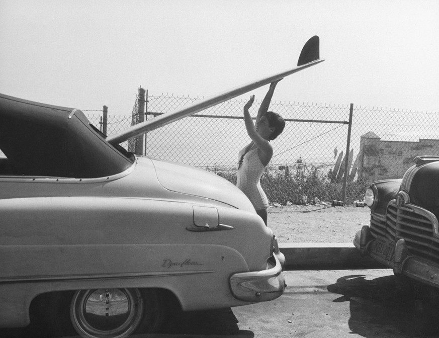 16 yr. old surfer Kathy (Gidget) Korner, while loading board into family car. (Photo by Allan Grant/The LIFE Picture Collection via Getty Images)