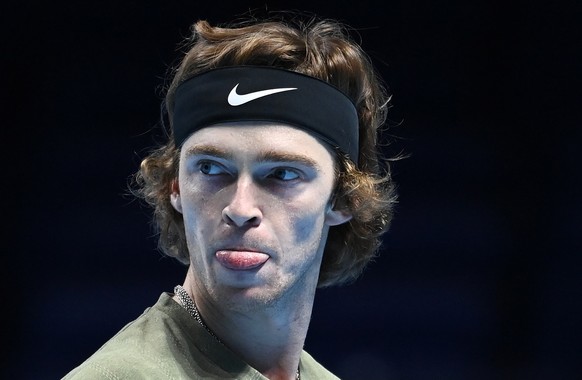 epa08829414 Andrey Rublev of Russia in action during his group stage match against Dominic Thiem of Austria at the ATP Finals tennis tournament in London, Britain, 19 November 2020. EPA/ANDY RAIN