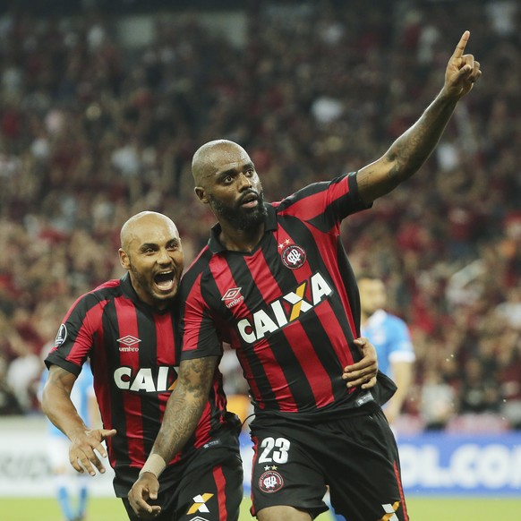Grafite of Brazil&#039;s Atletico Paranaense, right, celebrates with teammate Jonathan, after scoring against Colombia&#039;s Millonarios, during a Copa Libertadores soccer match in Curitiba, Brazil,  ...