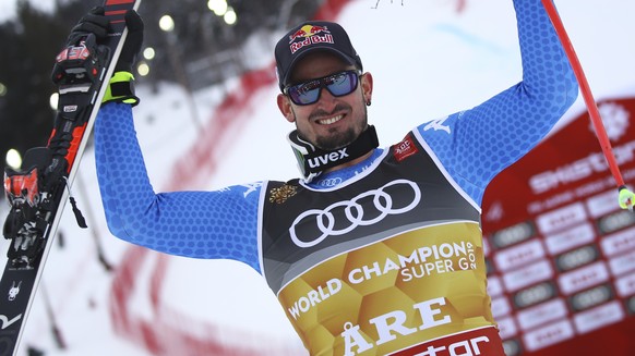 Italy&#039;s Dominik Paris celebrates in the finish area after winning the men&#039;s super-G, in Are, Sweden, Wednesday, Feb. 6, 2019. (AP Photo/Marco Trovati)