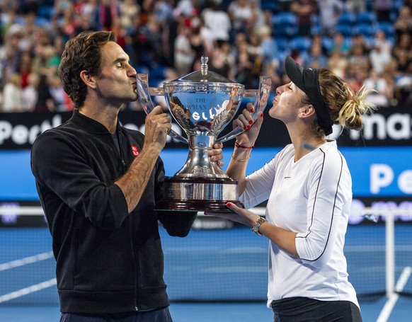 epaselect epa07264149 Roger Federer and Belinda Bencic of Switzerland hold up the Hopman Cup after winning the mixed doubles match between Switzerland and Germany on day 8 of the Hopman Cup tennis tou ...