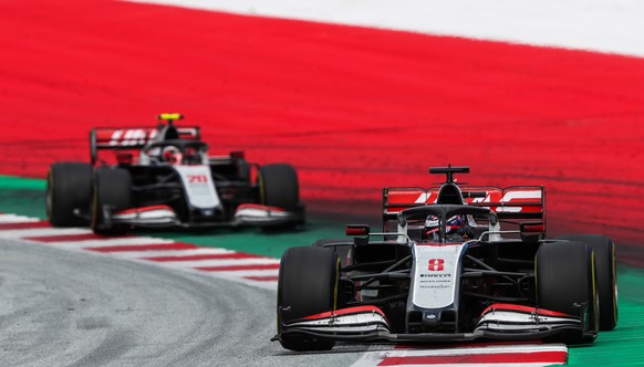 epa08542061 A handout photo made available by the FIA shows French Formula One driver Romain Grosjean of the Haas F1 Team leads Danish Formula One driver Kevin Magnussen of the Haas F1 Team during the ...