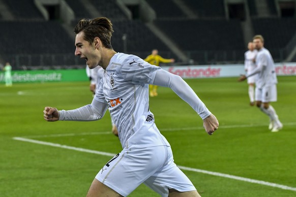 CORRECTS TO DISALLOWED GOAL - Moenchengladbach&#039;s Florian Neuhaus celebrates a goal that was later disallowed by a VAR decision during the German Bundesliga soccer match between Borussia Moencheng ...