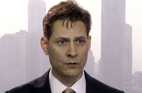 FILE - In this March 28, 2018, file imag made from video, Michael Kovrig, an adviser with the International Crisis Group, a Brussels-based non-governmental organization, speaks during an interview in  ...
