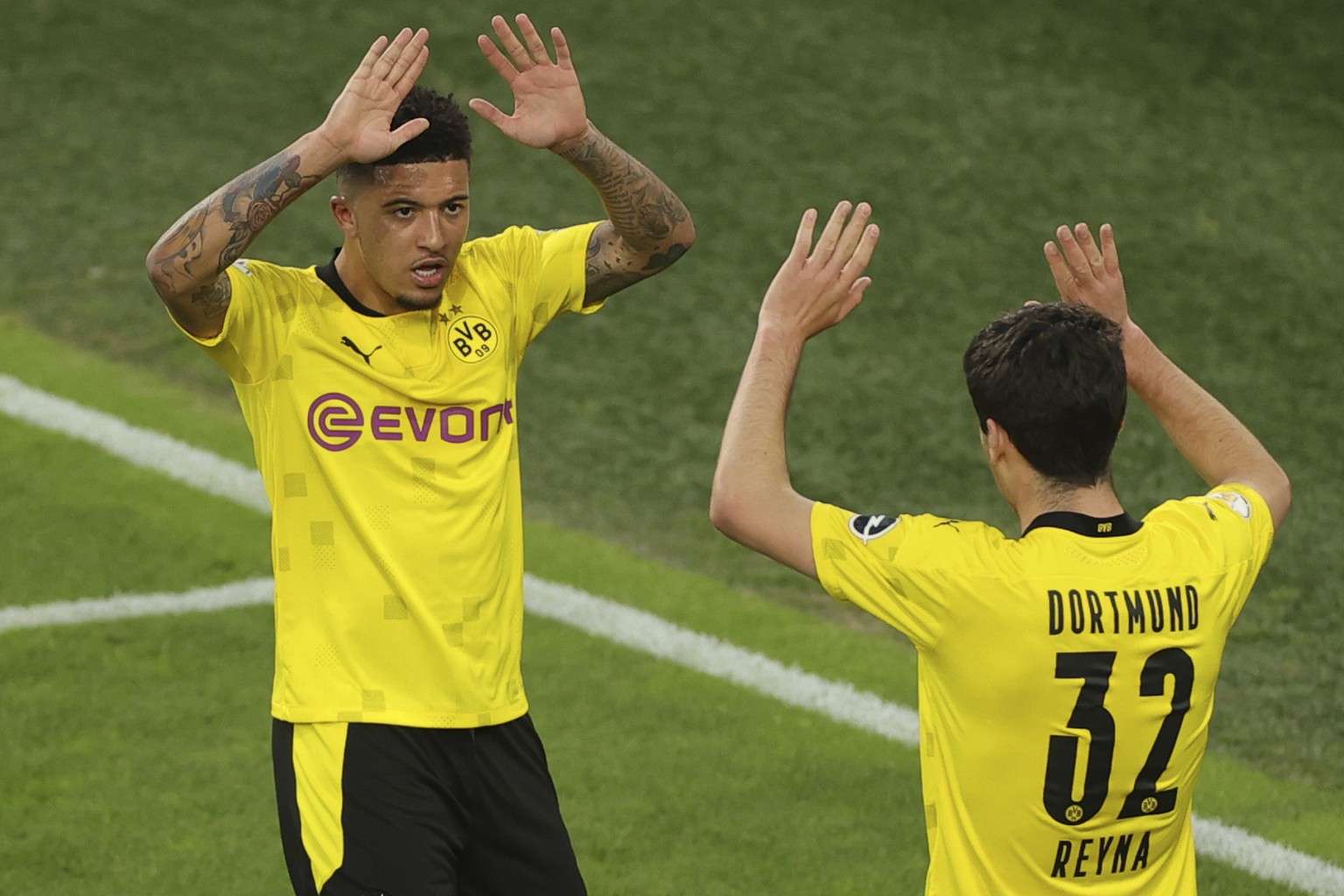 Dortmund&#039;s Giovanni Reyna celebrates after scoring his side&#039;s opening goal with Dortmund&#039;s Jadon Sancho during the German Soccer Cup semifinal match between Borussia Dortmund and Holste ...