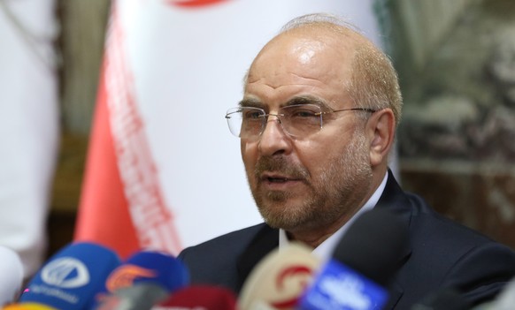 epa09373976 Iranian Parliament Speaker Mohammad Baqer Qalibaf speaks during a press conference with the Speaker of the Syrian People���s Assembly, Hamouda Al-Sabbagh, in Damascus, Syria, on 28 July 20 ...