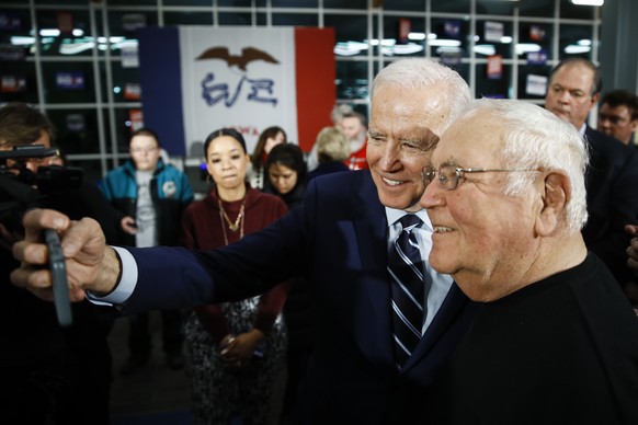 Democratic presidential candidate former Vice President Joe Biden poses for a photograph with an attendee during a campaign event at Iowa Central Community College, Tuesday, Jan. 21, 2020, in Fort Dod ...