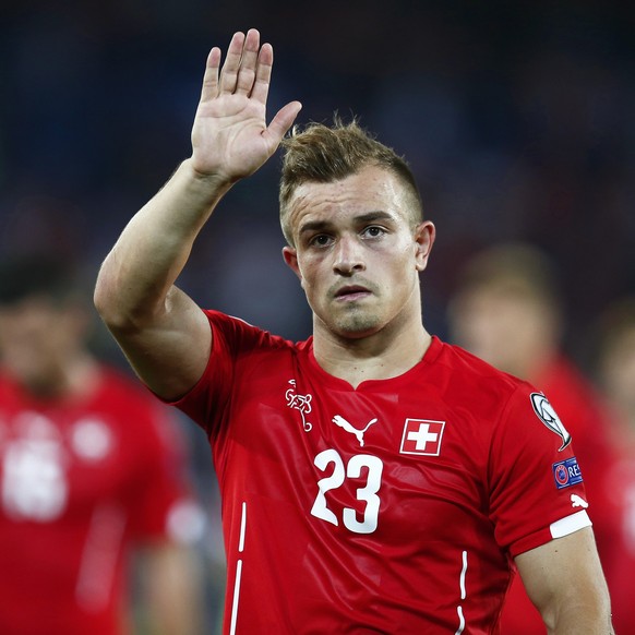 epa04551092 Swiss forward Xherdan Shaqiri waves to supporters as he leaves the pitch after the UEFA EURO 2016 qualifying soccer match between Switzerland and England at the St. Jakob-Park stadium in B ...
