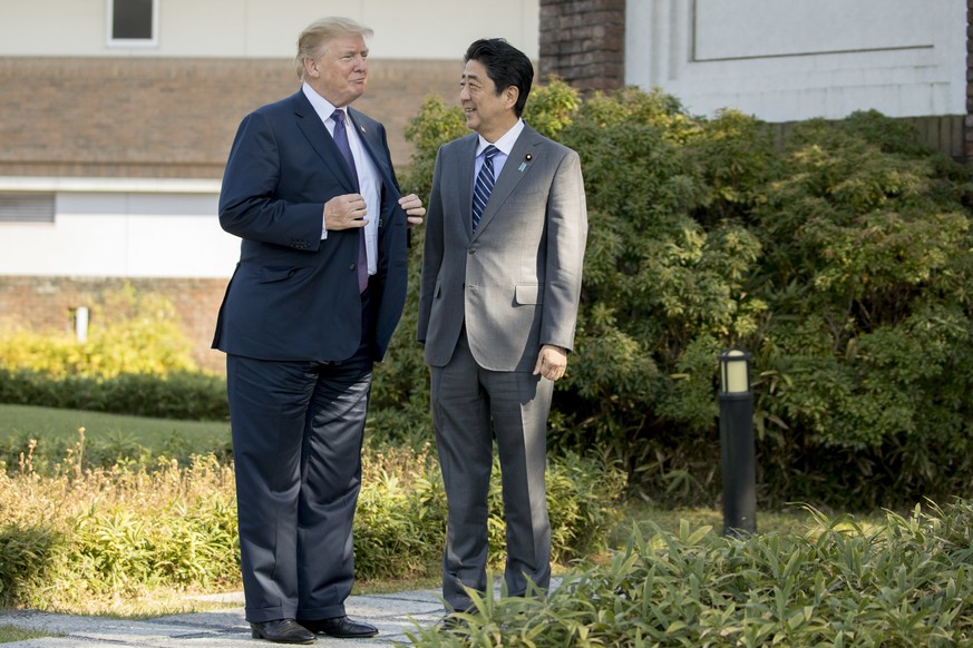President Donald Trump meets with Japanese Prime Minister Shinzo Abe at Kasumigaseki Country Club, Sunday, Nov. 5, 2017, in Kawagoe, Japan. Trump is on a five country trip through Asia traveling to Ja ...